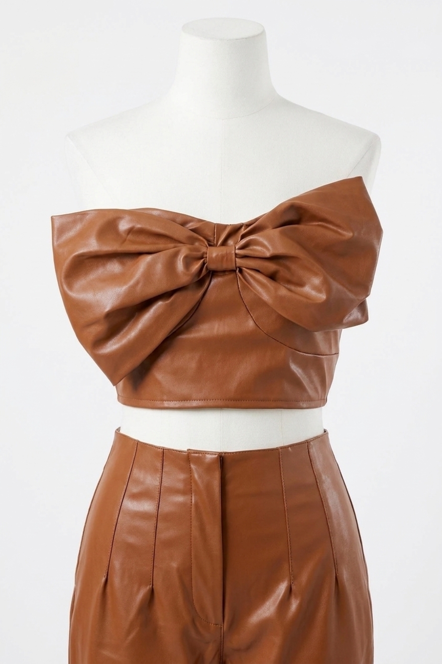 NEW DAY + MOON faux leather strapless bow tie crop top in light brown